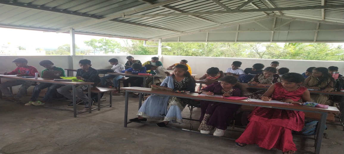 Students Engaged in the Drawing and Writing Competition